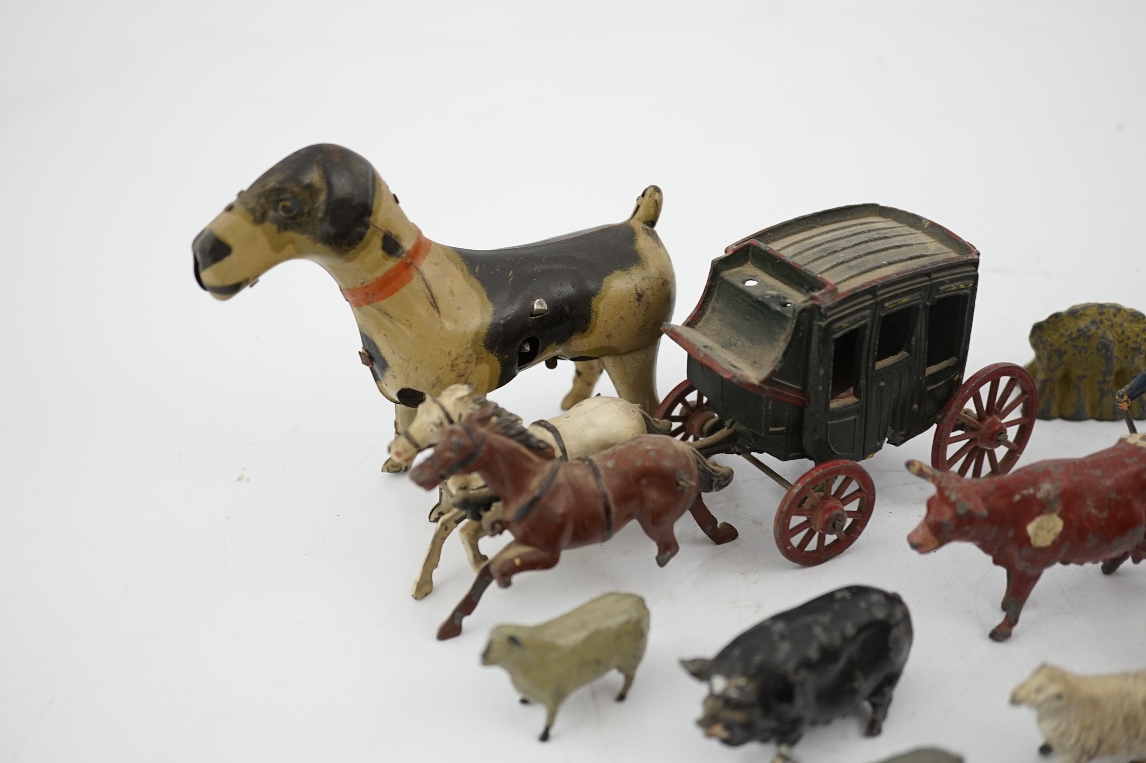 A collection of Britains, etc. lead farm animals and accessories, including the farmer, farmer’s wife, a coach and horses and other figures